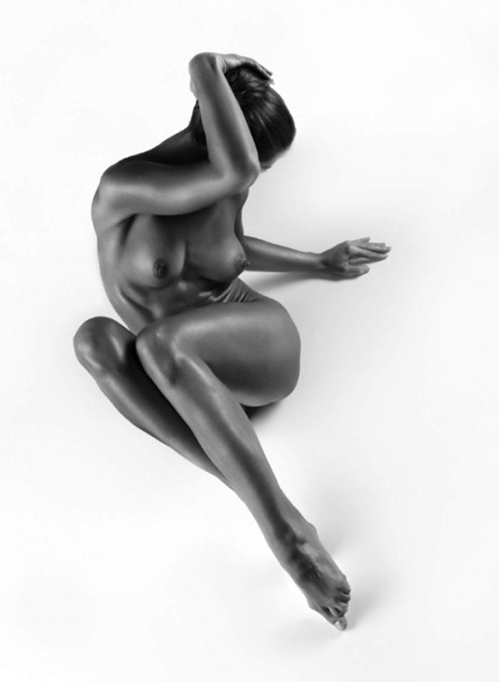 Poses for an erotic photo shoot
