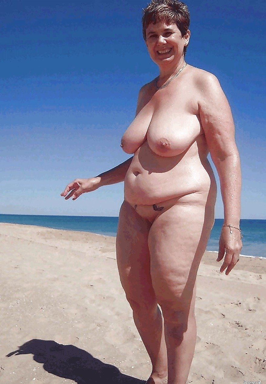 Elderly with big tits on the beach