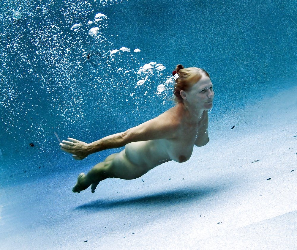Naked girls jump into the water