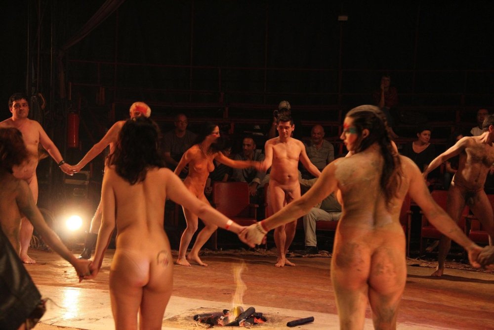 Naked actors on the stage of the theater